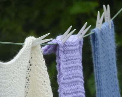 Woolen scarves hanging on a clothes line